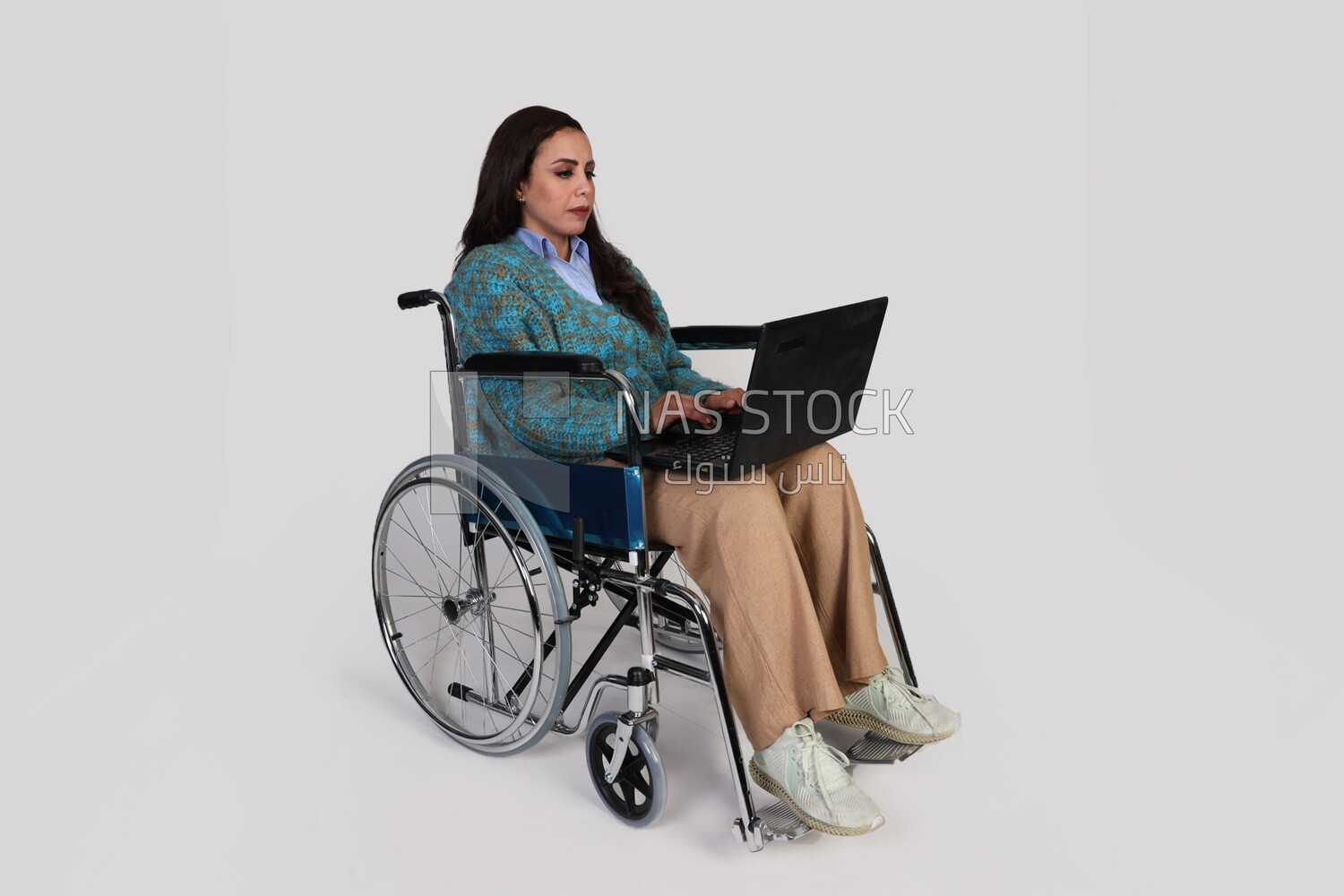 beautiful girl with a disability sitting in a wheelchair