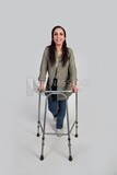 woman with an injured leg walking with crutches, patient, medicine and health care concept, medical professions and jobs.