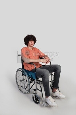 man sitting in a wheelchair, patient, the concept of medicine and health care, an appointment to receive treatment in the hospital, emergency.