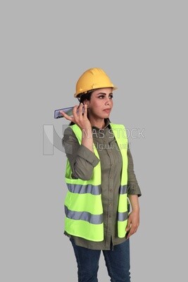 woman engineer holding a mobile phone hearing messages, a construction engineer wearing a work safety suit, work helmet, work uniform, construction project, white background
