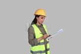 woman engineer holding a construction plan in her hand, a construction engineer wearing a work safety suit, work helmet, work uniform, construction project, white background