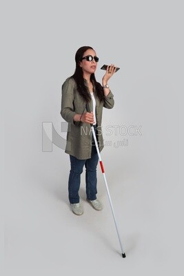 blind woman walking with a white cane holding her mobile, patient, medicine and health care concept, medical professions and jobs.