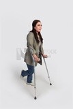 woman with an injured leg walking with crutches, patient, medicine and health care concept, medical professions and jobs.