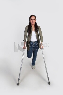 woman with an injured leg walking with crutches, patient, medicine and health care concept, medical professions and jobs.