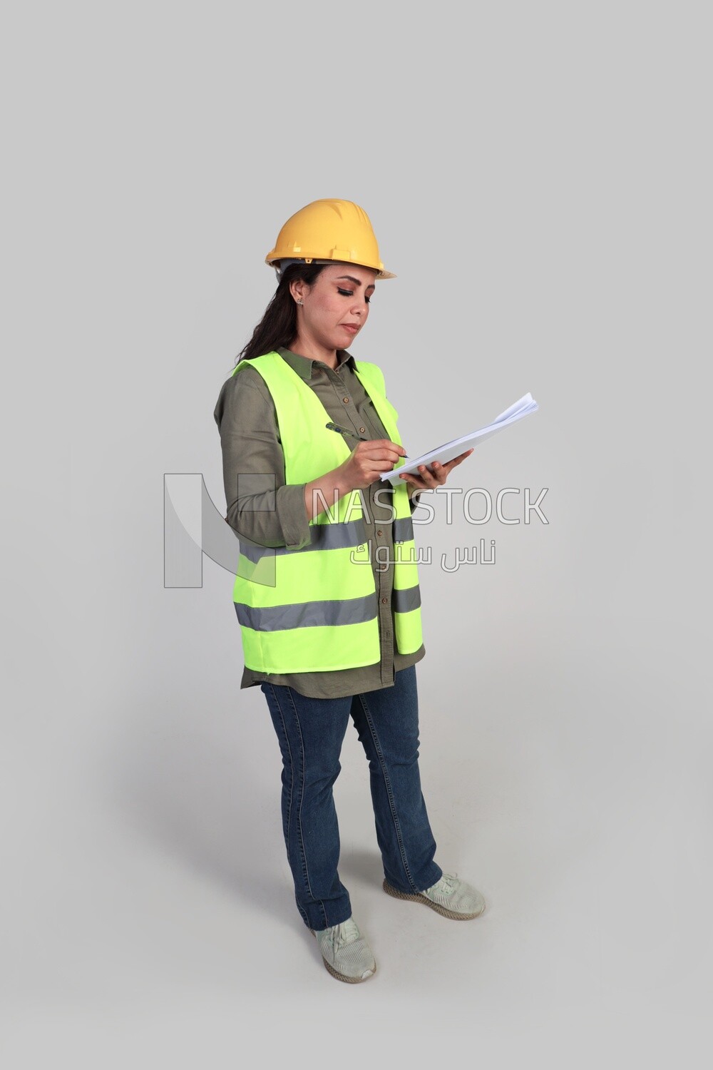 woman engineer holding a construction plan in her hand, a construction engineer wearing a work safety suit, work helmet, work uniform, construction project, white background