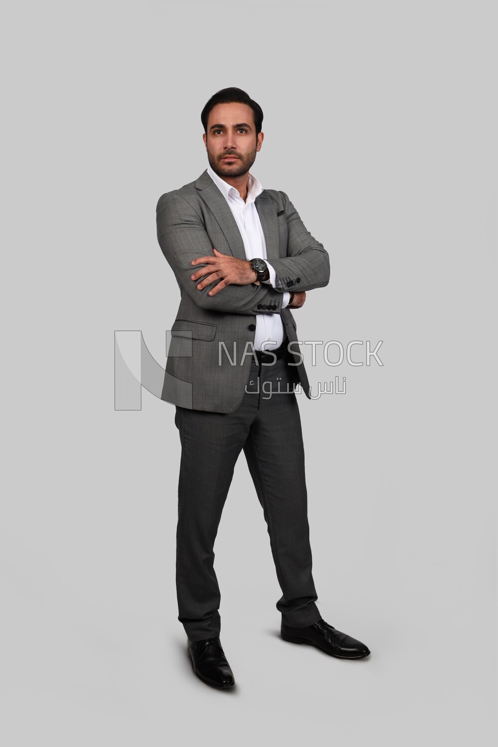 Photo of a businessman with a formal suit with crossed hands, business development and partnerships, business meeting, Model