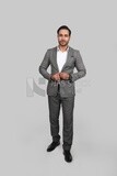 Photo of a businessman with a formal suit holding his hand on the suit button, business development and partnerships, business meeting, Model