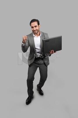 Photo of a businessman with a formal suit holding a laptop, business development and partnerships, business meeting, Model