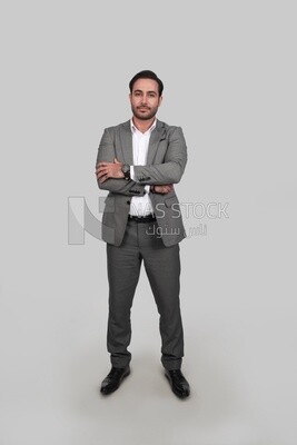 Photo of a businessman with a formal suit with crossed hands, business development and partnerships, business meeting, Model