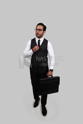 Photo of a businessman with a formal suit holding a leather bag, business development and partnerships, business meeting, Model