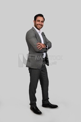 Photo of a businessman with a formal suit with crossed hands, business development and partnerships, business meeting, Model