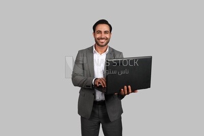 Businessman with a formal suit holding a laptop, business development and partnerships, business meeting, Model