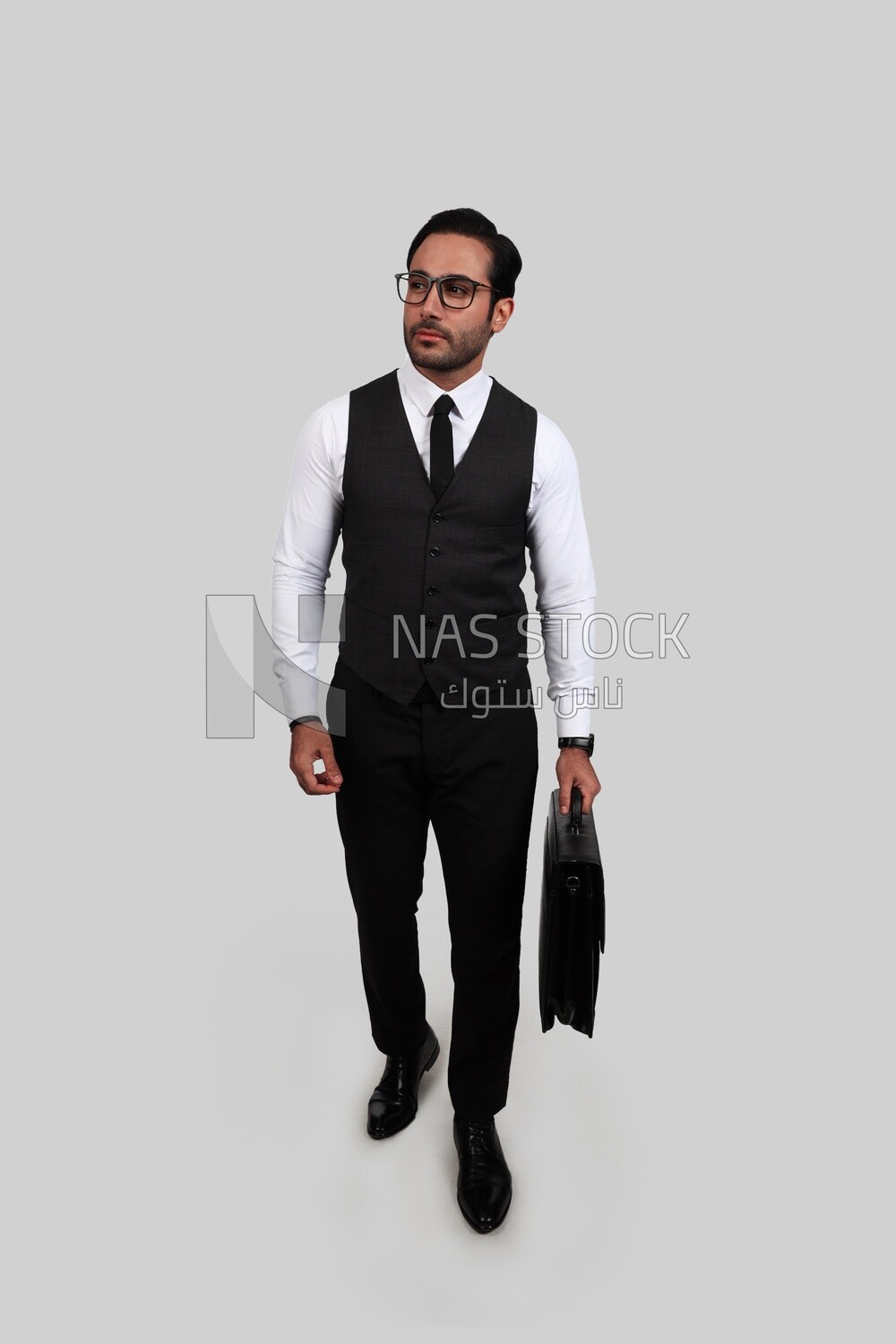 Photo of a businessman with a formal suit holding a leather bag, business development and partnerships, business meeting, Model