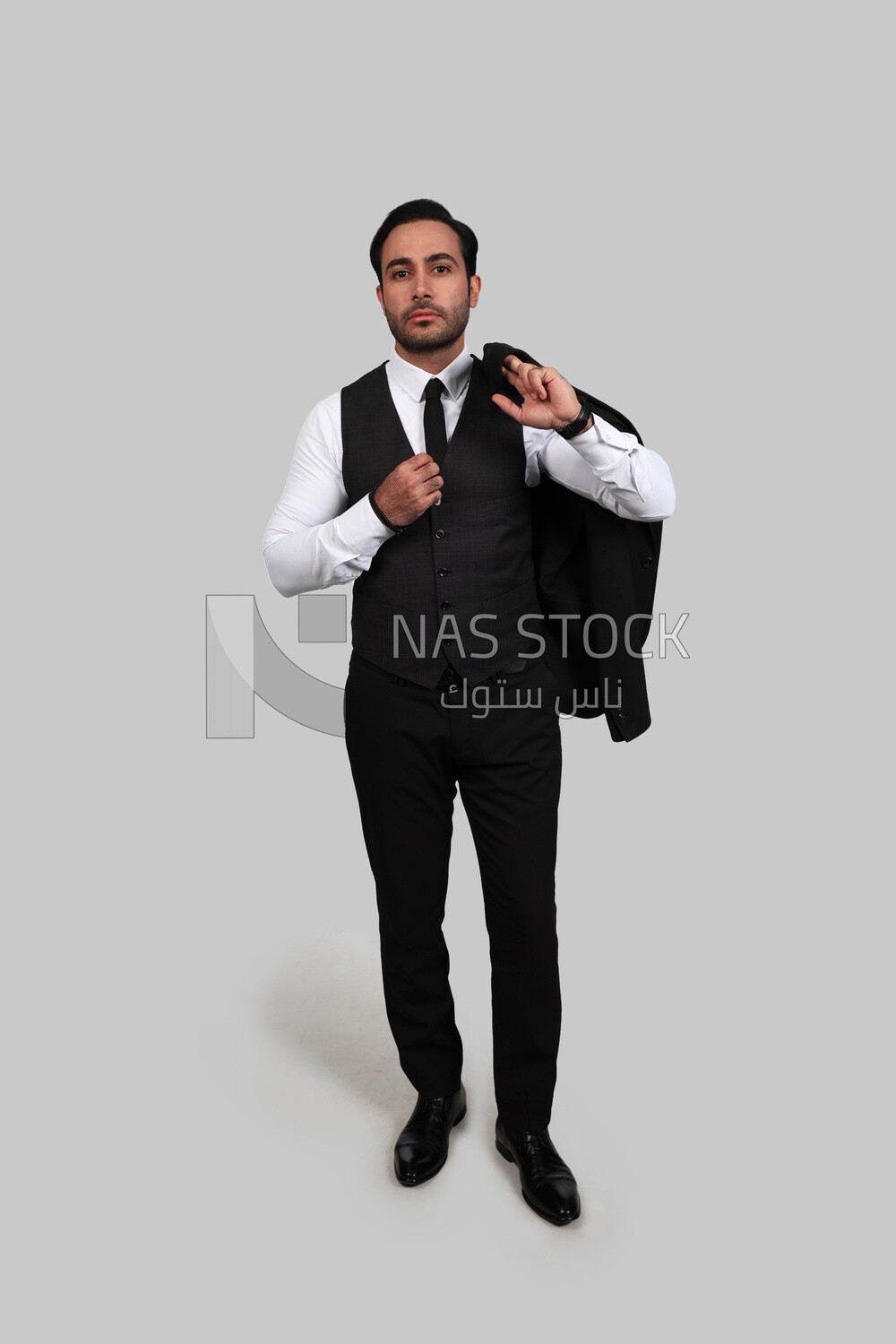 Photo of a businessman with a formal suit putting his hand on the tie, business development and partnerships, business meeting, Model