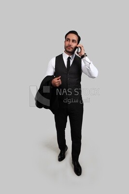 Photo of a businessman with a formal suit talking in his mobile phone, business development and partnerships, business meeting, Model