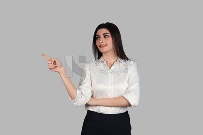 Photo of a businesswoman with formal wear pointing away, business development and partnerships, business meeting, Model