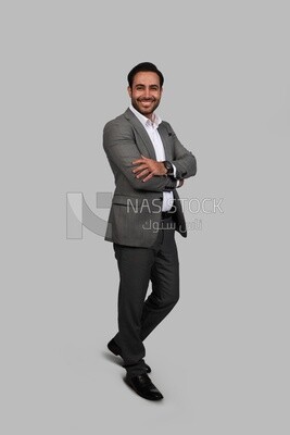 Photo of a businessman with a formal suit with crossed hands, business development and partnerships, business meeting, Model