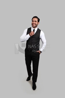 Photo of a businessman with a formal suit putting his hand on the tie, business development and partnerships, business meeting, Model