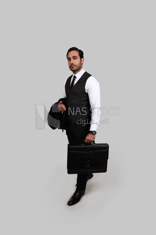 Photo of a businessman with a formal suit holding a leather bag, business development and partnerships, business meeting, Model