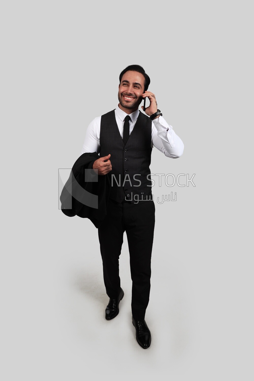 Photo of a businessman with a formal suit talking in his mobile phone, business development and partnerships, business meeting, Model