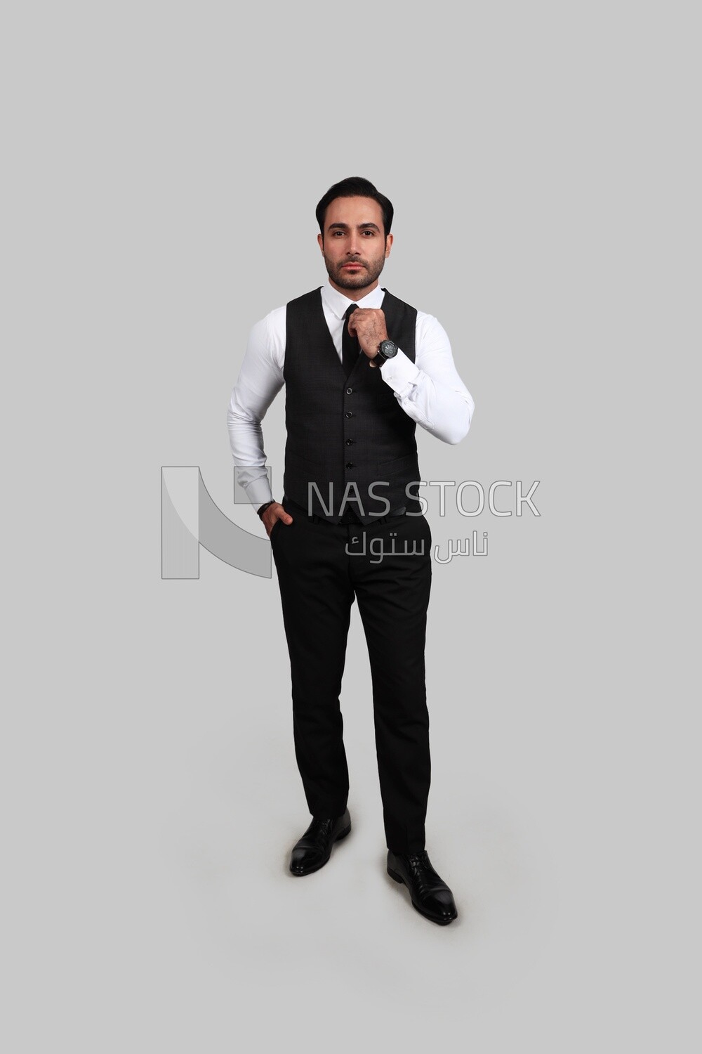 Photo of a businessman with a formal suit putting his hand on the tie, business development and partnerships, business meeting, Model