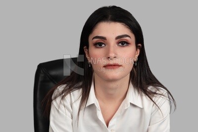 Close up photo of a businesswoman with formal wear sitting on a chair, business development and partnerships, business meeting, Model