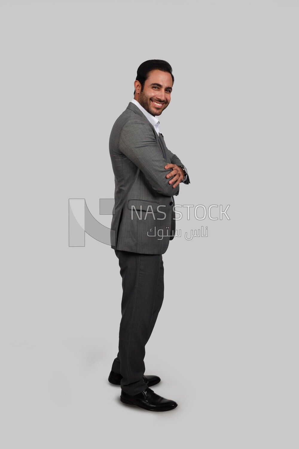 Photo of a businessman with a formal suit with crossed hands, business development and partnerships, business meeting, Model