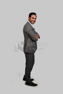 Photo of a businessman with a formal suit with crossed hands, business development and partnerships, business meeting, Model