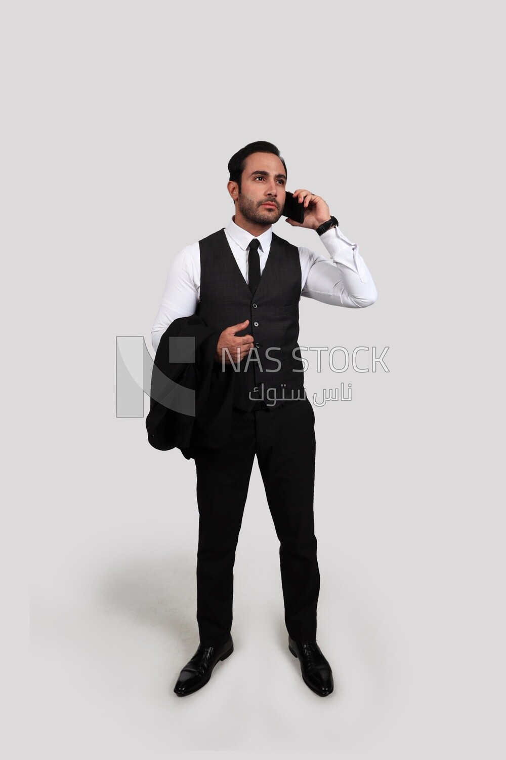 Photo of a businessman with a formal suit talking in his mobile phone, business development and partnerships, business meeting, Model