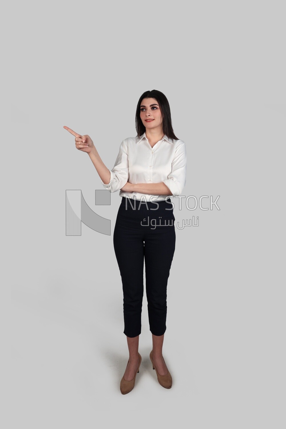 Photo of a businesswoman with formal wear pointing away, business development and partnerships, business meeting, Model