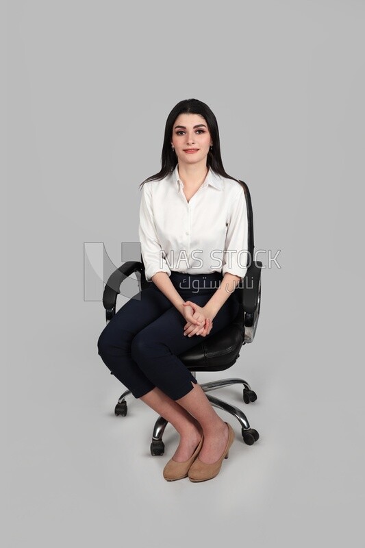 Photo of a businesswoman with formal wear sitting on a chair, business development and partnerships, business meeting, Model