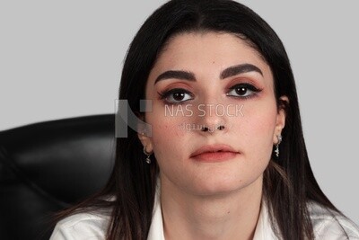 Close up photo of a businesswoman with formal wear sitting on a chair, business development and partnerships, business meeting, Model