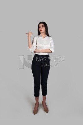 Photo of a businesswoman with formal wear pointing away, business development and partnerships, business meeting, Model