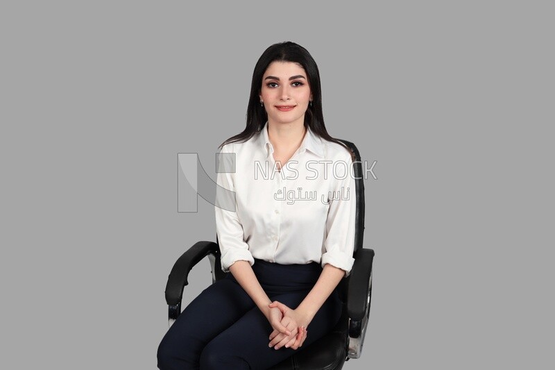 Photo of a businesswoman with formal wear sitting on the chair, business development and partnerships, business meeting, Model