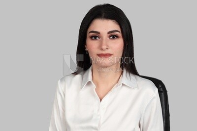 Close up photo of a businesswoman with formal wear sitting on a chair, business development and partnerships, business meeting, Model