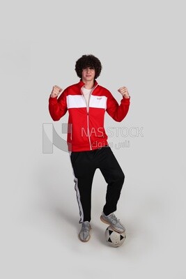 soccer player putting his foot on the ball