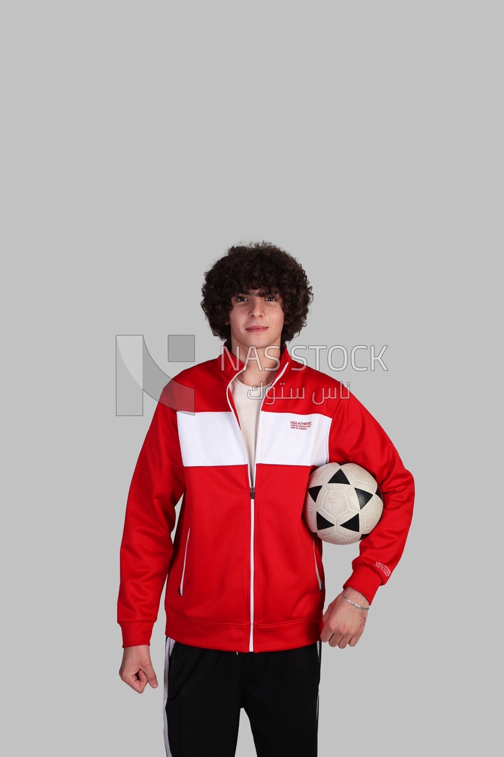 soccer player holding the ball