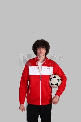 soccer player holding the ball