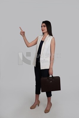 Business woman with formal wear holding a leather bag