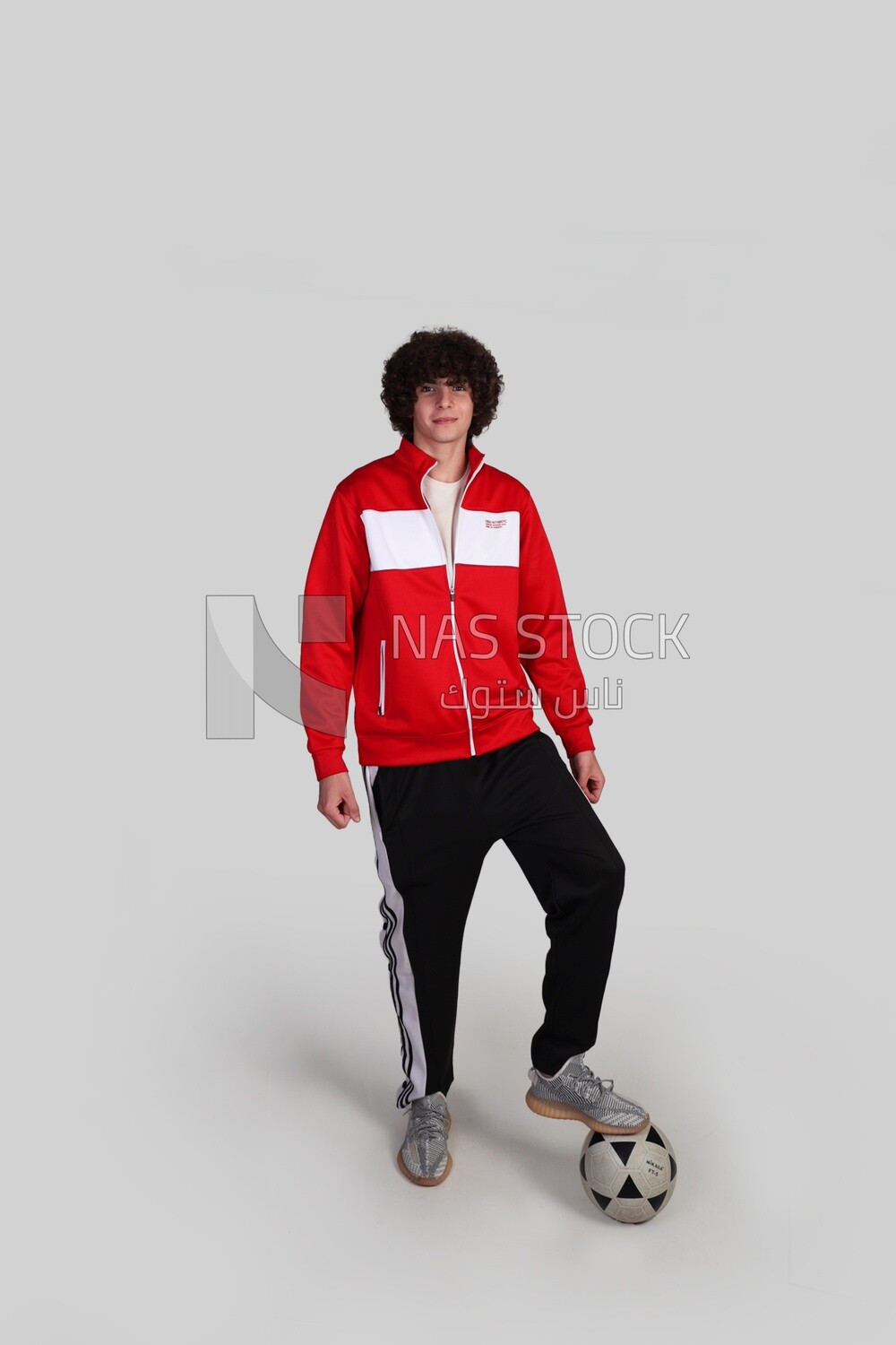 soccer player putting his foot on the ball