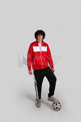 soccer player putting his foot on the ball