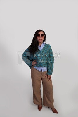 woman in autumn clothes and wearing sunglasses