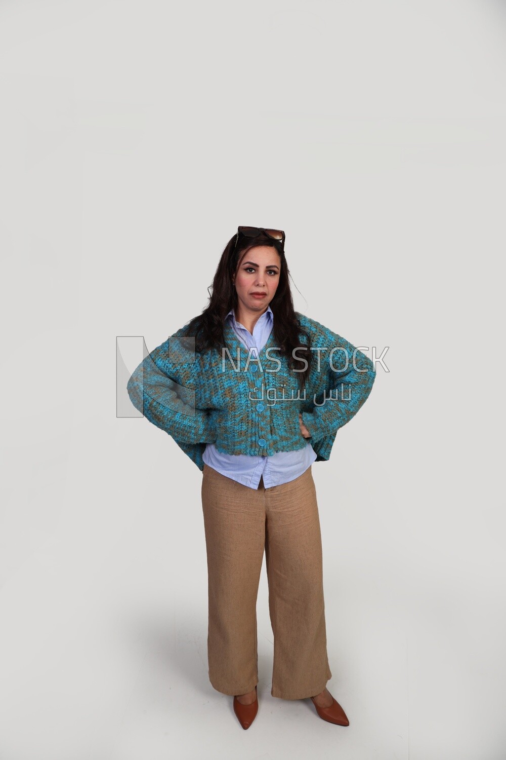 woman laughing hard and placing her hand on her hip