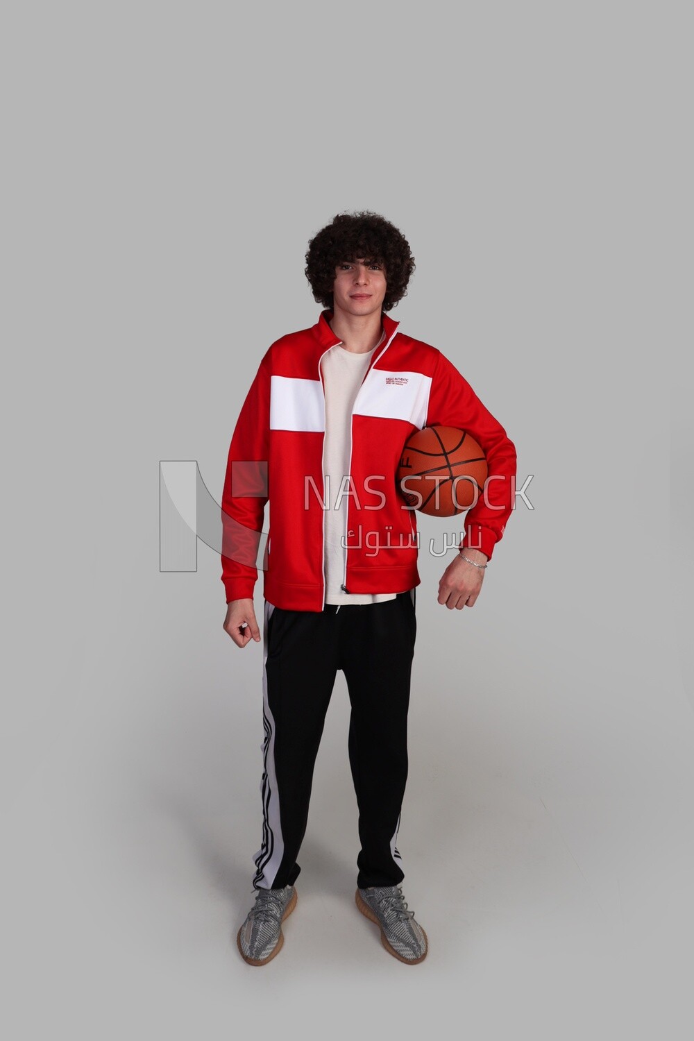 young man holding a basketball