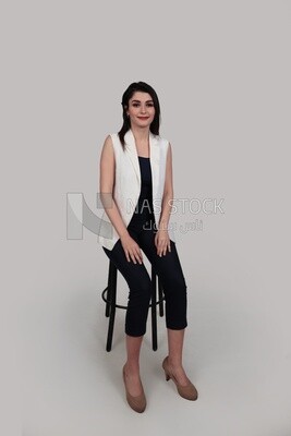 Photo of a businesswoman with formal wear sitting on the chair, business development and partnerships, business meeting, Model