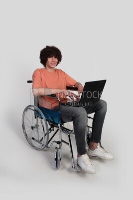 man sitting in a wheelchair with a laptop, patient, the concept of medicine and health care, an appointment to receive treatment in the hospital, emergency, disabled people