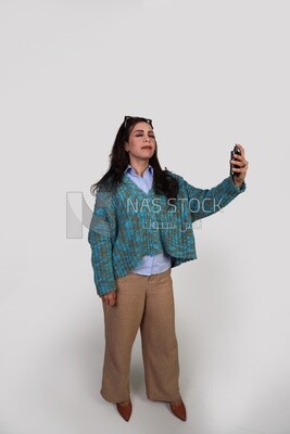 elegant girl getting ready to go and using perfume