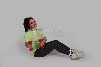 girl doing exercises using gym equipment