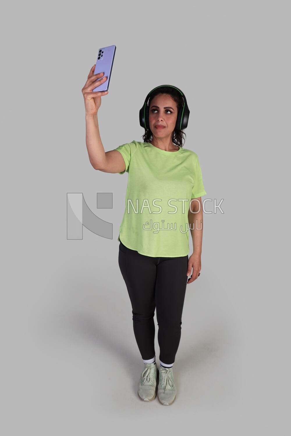 beautiful girl in sportswear taking a selfie