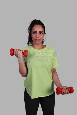 athletic girl doing weightlifting exercises